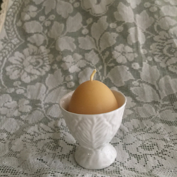 Egg candle in eggcup